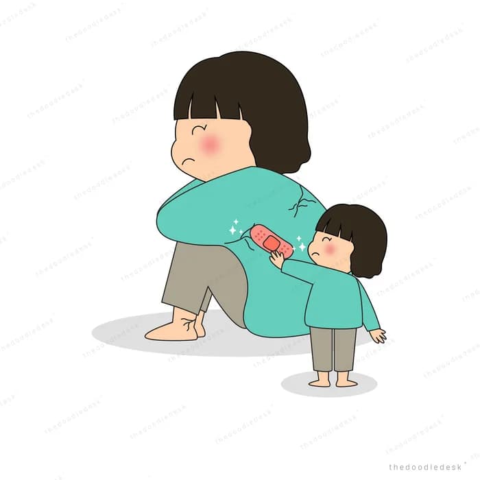Girl kneeling to comfort a smaller child with a bandage