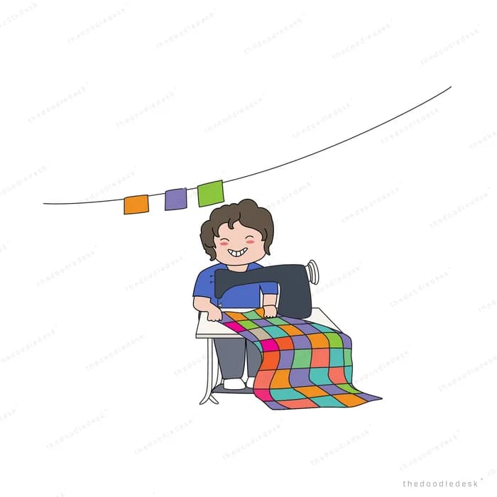 Person working at a desk under a string of bunting