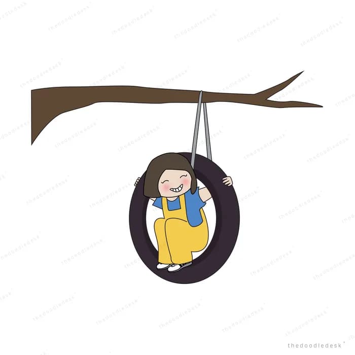 Child sitting in a tyre swing hanging from a branch