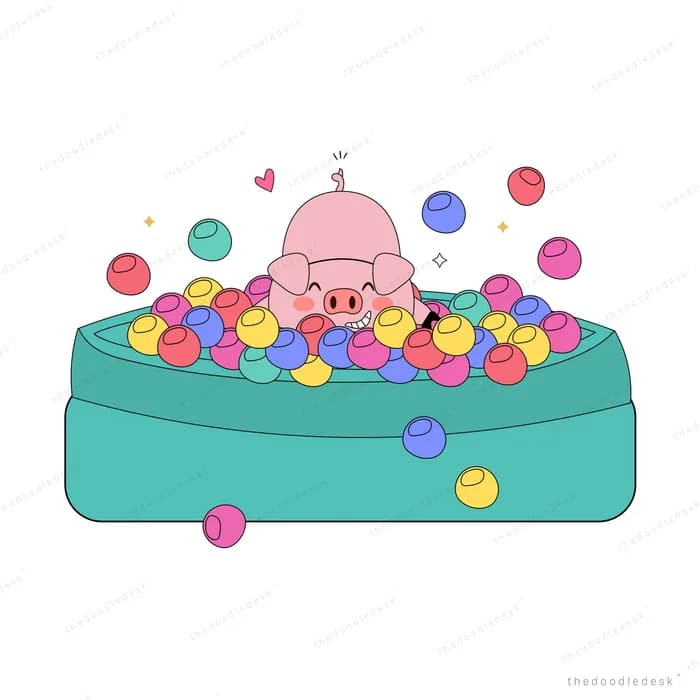 Baby sitting in a ball pit of colourful balls