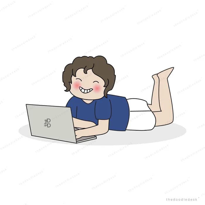 Boy lying on his front using a laptop