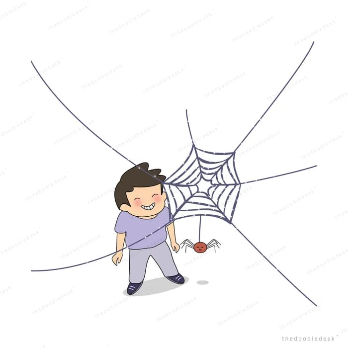 Boy tangled in a large spider web