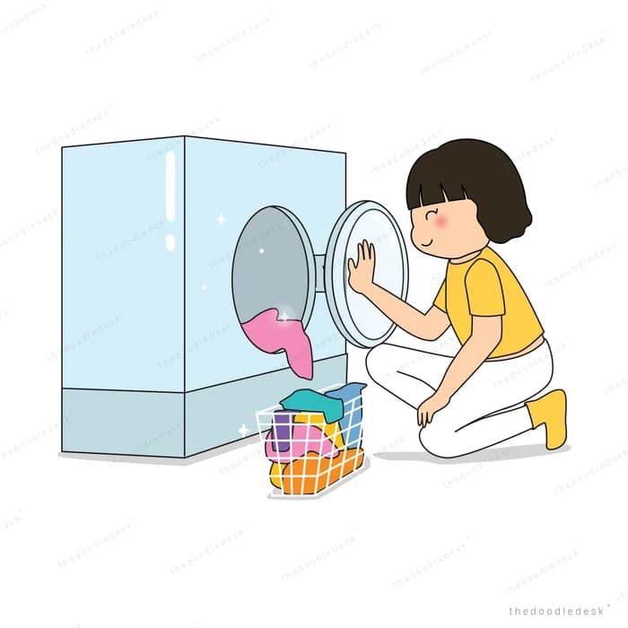 Girl loading clothes into a washing machine