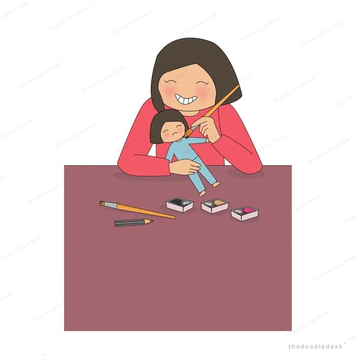 Woman working at a desk while holding a baby