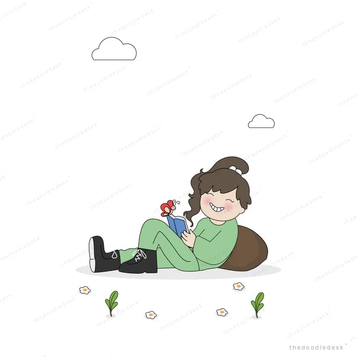 Woman lying on grass holding a small plant