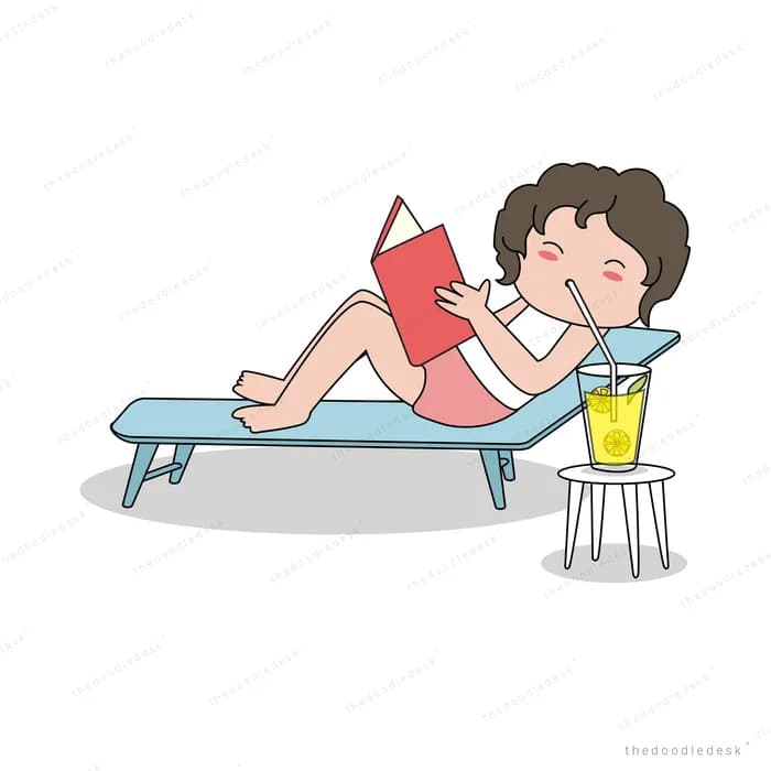 Woman reading on a sun lounger with a drink