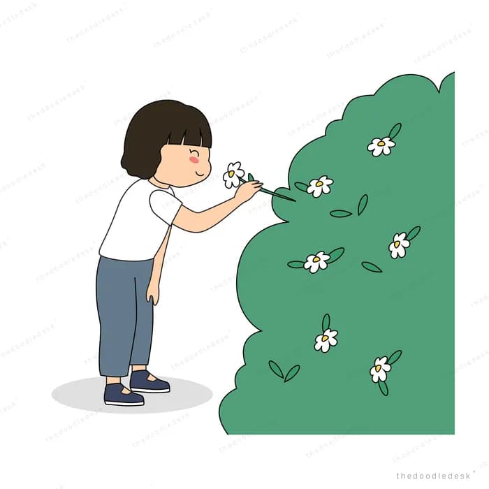 Boy reaching toward a flowering hedge