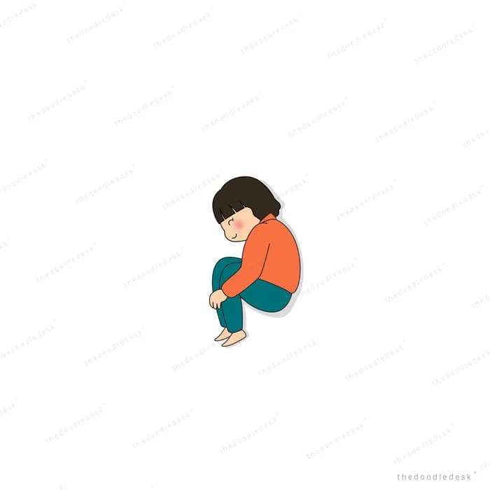 Boy sitting curled up alone