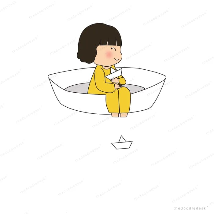Girl sitting in a large white paper boat