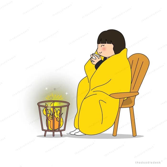 Woman wrapped in a yellow blanket on a chair with a mug beside a glowing brazier