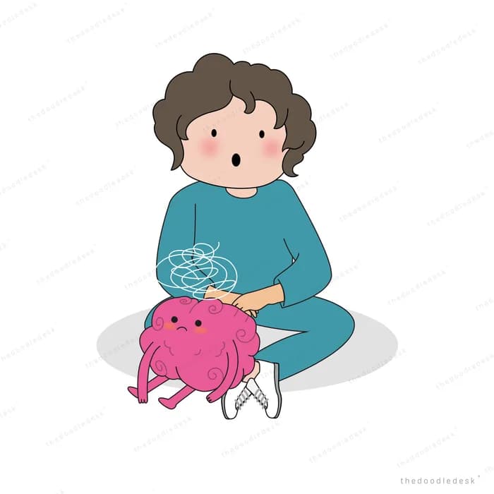 Boy sitting on the floor holding blue yarn beside a pink toy pig