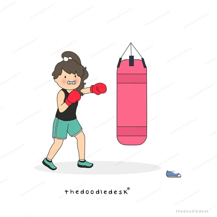 Girl in boxing gloves punching a pink punching bag
