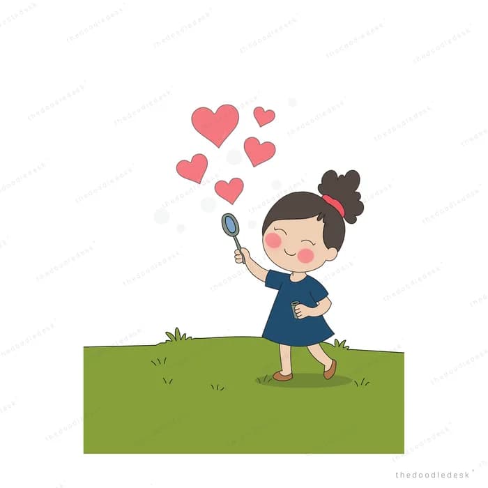 Girl blowing heart-shaped bubbles from a wand on a green field