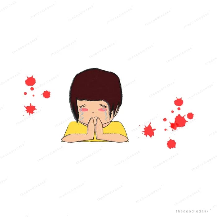 Boy pressing his palms together in a namaste with red petals falling