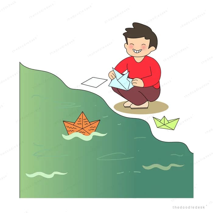 Boy kneeling on a green bank folding paper boats and floating them on the water