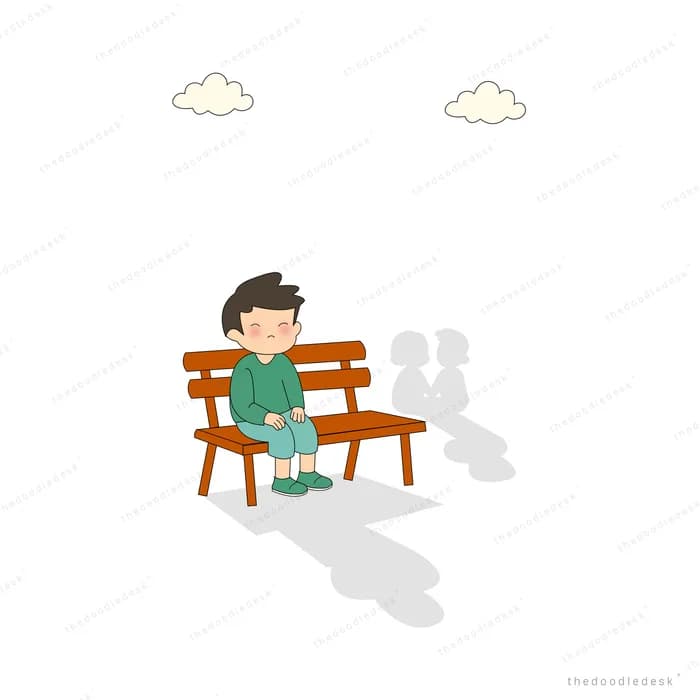 Boy sitting alone on a wooden bench with a long shadow behind him