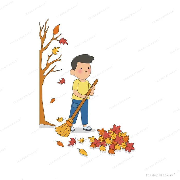 Boy sweeping fallen autumn leaves into a pile with a broom