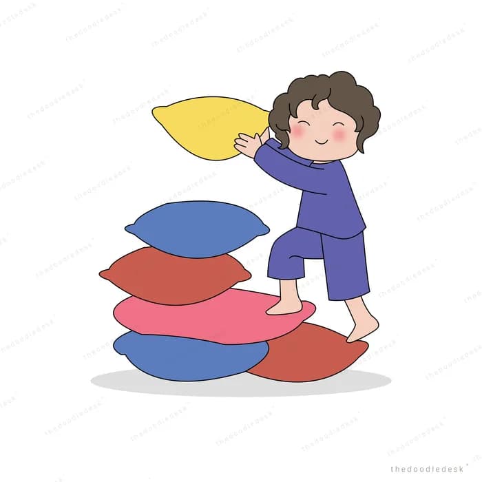 Boy climbing a heap of cushions holding a yellow pillow overhead