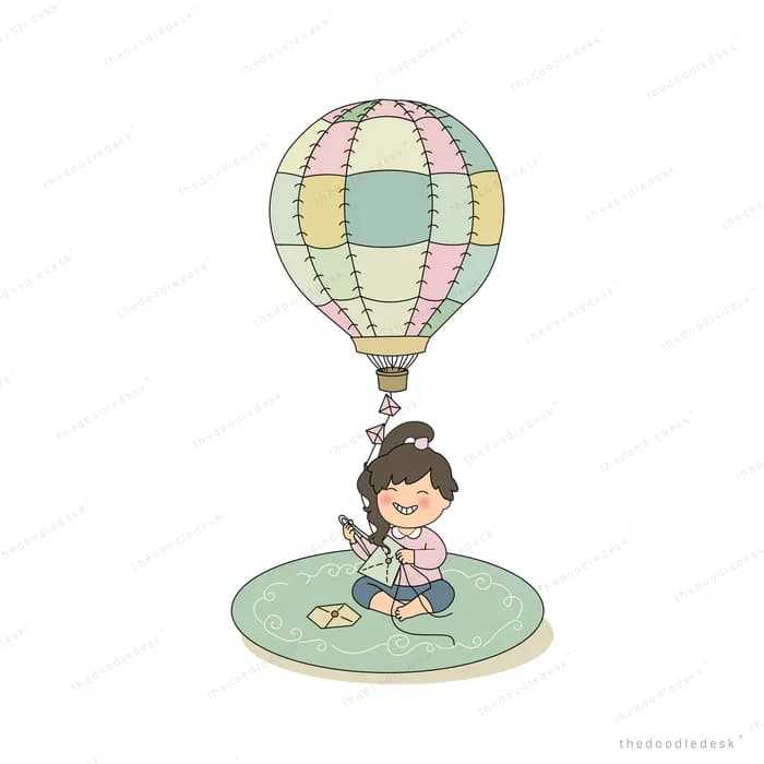 Boy sitting cross-legged on a green mat holding the string of a pastel hot air balloon
