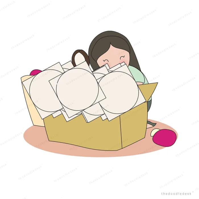 Girl kneeling behind an open cardboard box full of colourful balls holding a magnifying glass