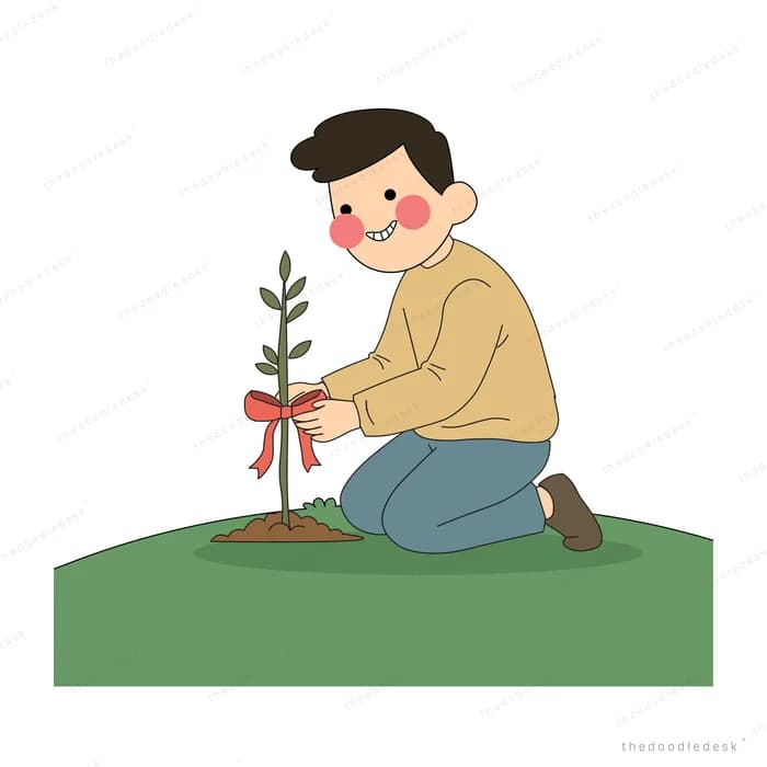 Man kneeling on grass to tie a red ribbon around a young sapling