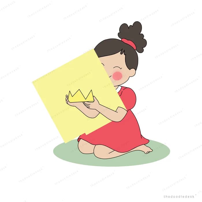 Girl lying back on the grass holding up a golden paper crown