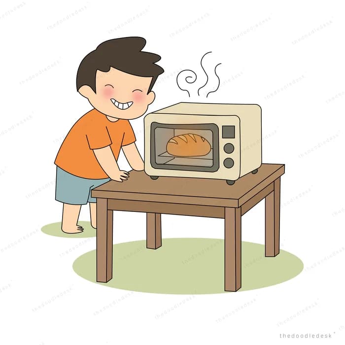 Boy at a wooden table taking a hot loaf out of a countertop oven