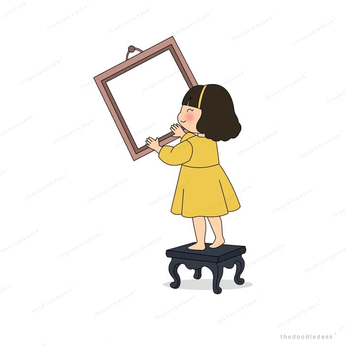 Girl standing on a stool holding up a large empty picture frame