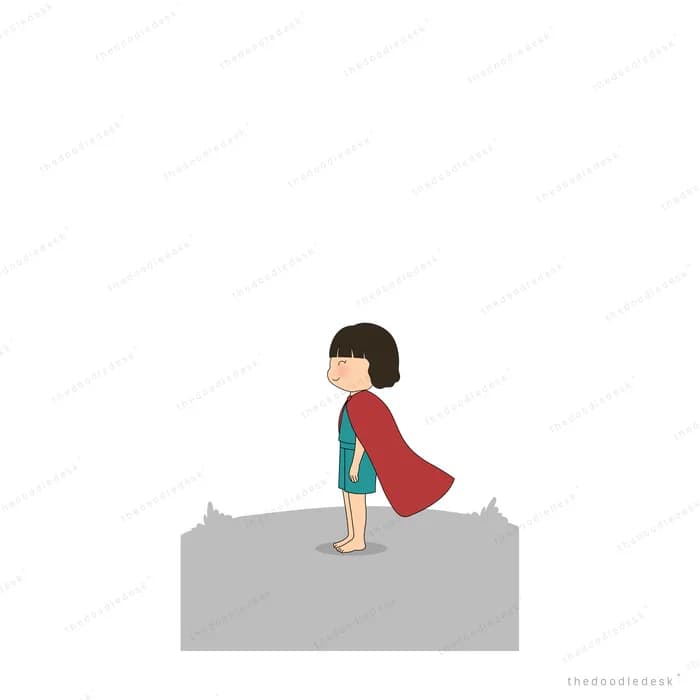 Girl in a red cape standing alone at the edge of a grey rock