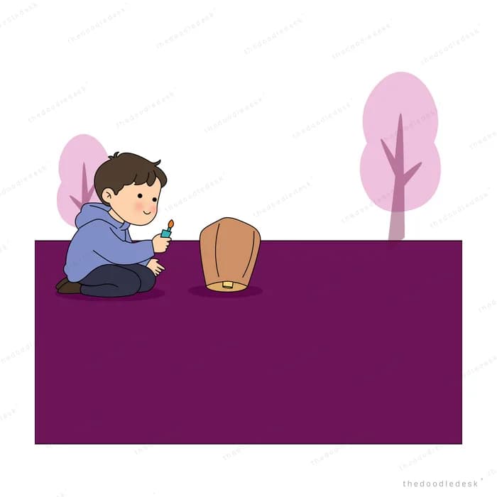 Boy kneeling on purple ground with an unlit paper sky lantern under pink trees