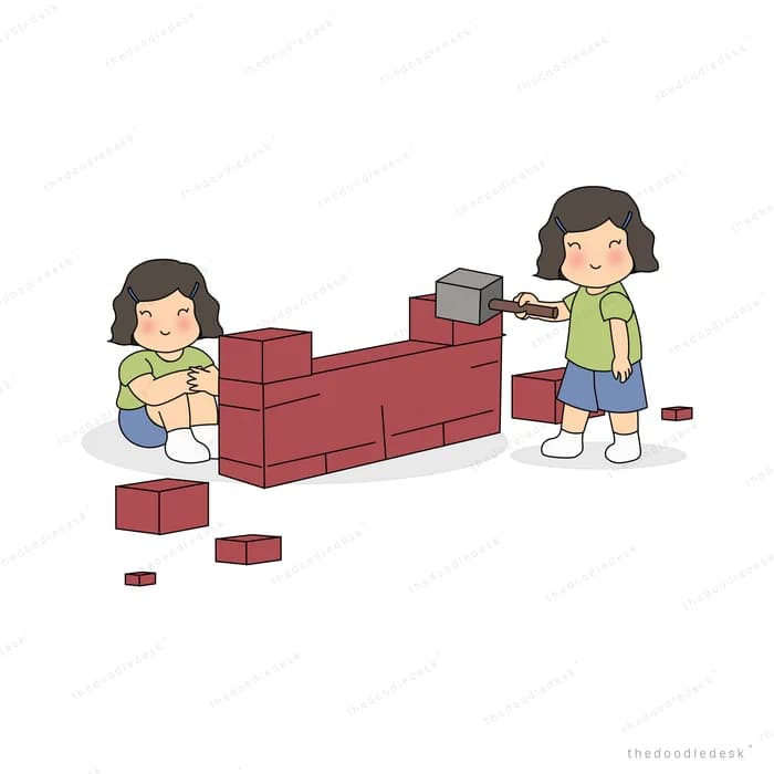 Two children knocking down the last low course of a brick wall