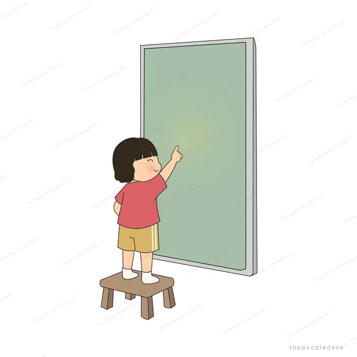 Boy standing on a wooden stool to draw on a tall green board