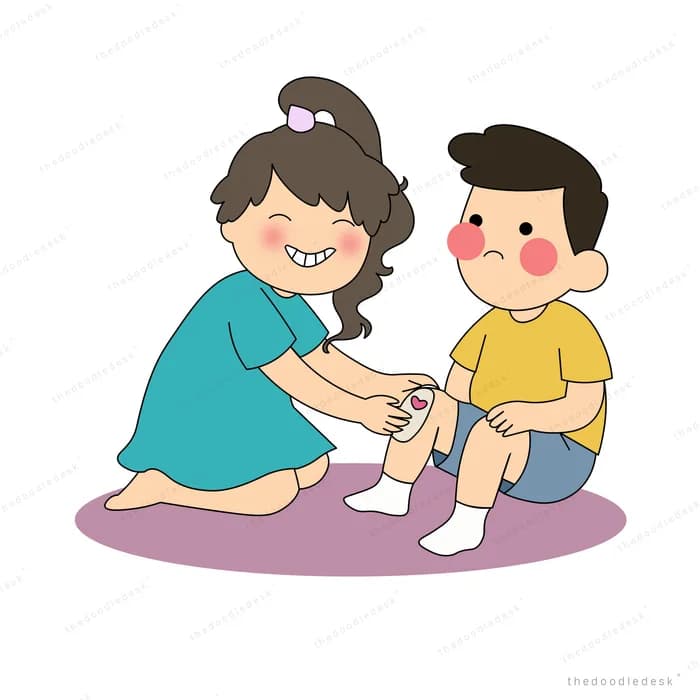 Woman kneeling to bandage a boy's scraped knee