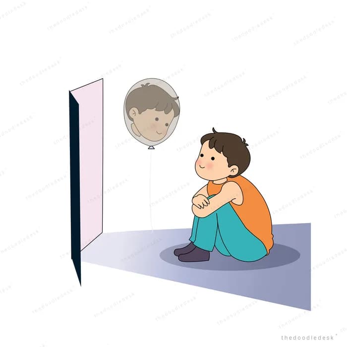 Boy hugging his knees under a floating grey sad faced balloon