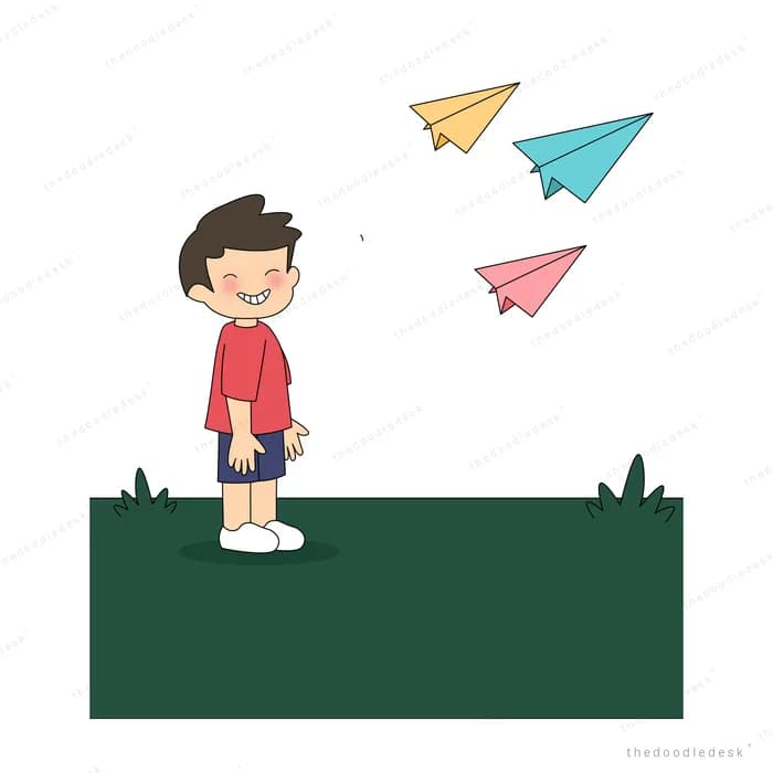 Boy looking down as coloured paper planes fly away above him
