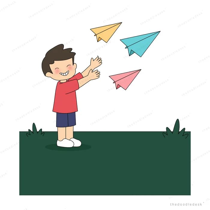 Boy launching coloured paper planes into the air with both hands