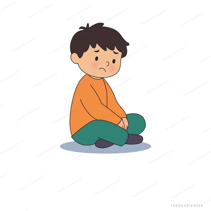 Worried boy in an orange jumper sitting cross-legged with his shoulders slumped
