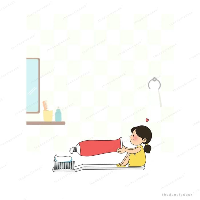 Small girl squeezing a giant toothpaste tube onto an oversized toothbrush in a bathroom