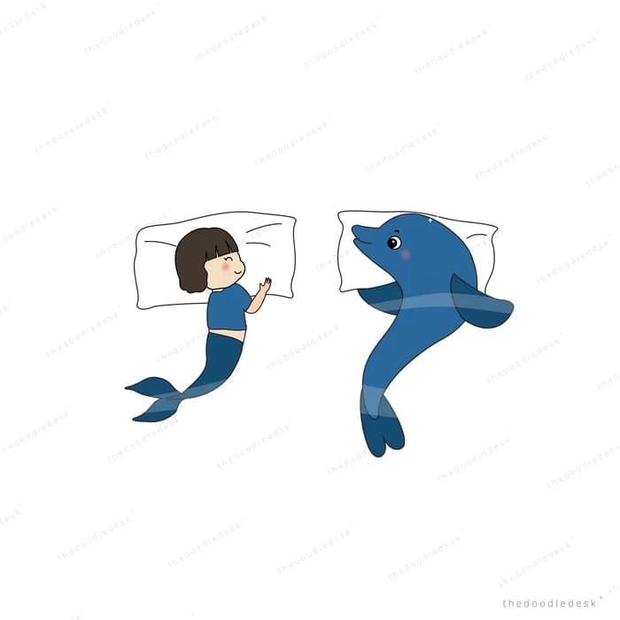 Girl as a mermaid swimming with a dolphin