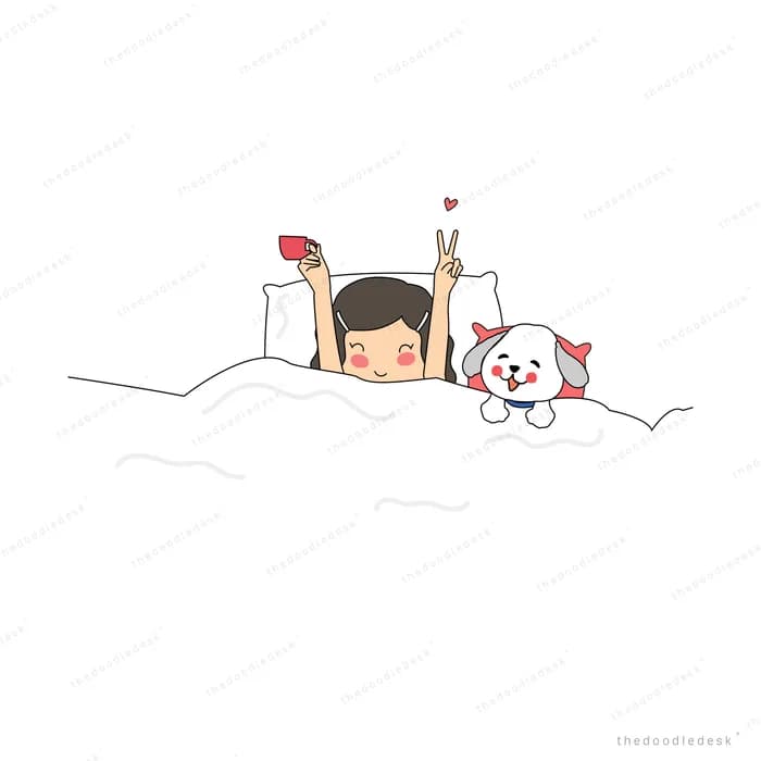 Girl lying in bed reading with two cats
