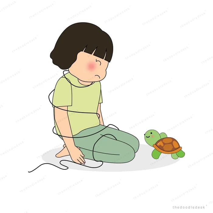 Girl sitting on the floor beside a turtle