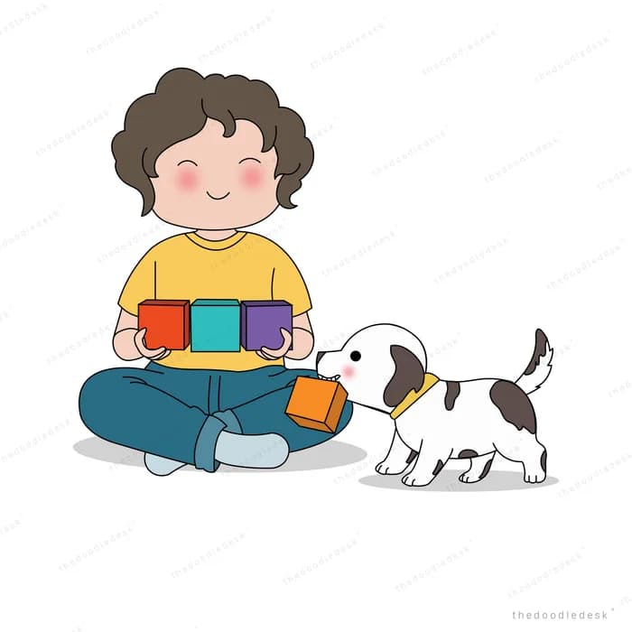 Boy sitting cross-legged holding coloured blocks while a spotted puppy nudges one over