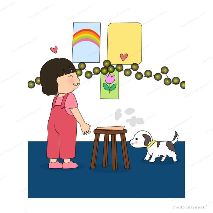 Girl hanging a dark bead garland across her drawings while a white dog watches