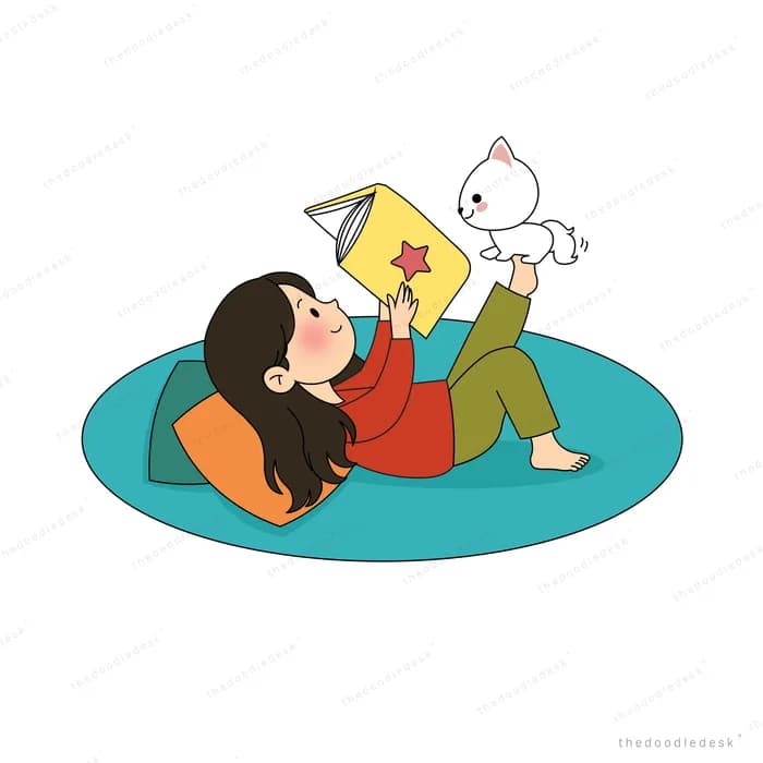 Woman lying back on a round teal rug holding up a book while a white puppy leaps at it