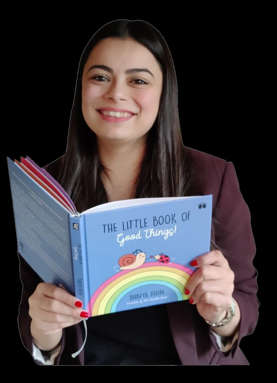 Bhavya Doshi holding The Little Book of Good Things!