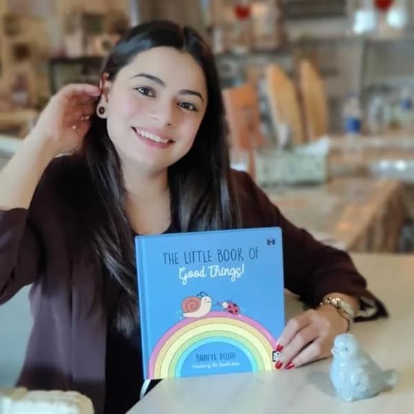 Bhavya Doshi holding The Little Book of Good Things